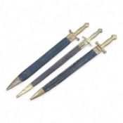 Three Continental infantry officer’s sidearms briquette, the first stamped Paris, in its brass