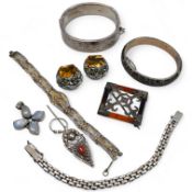 A group of silver jewels, comprising: a Scottish hardstone brooch of square outline; a pair of