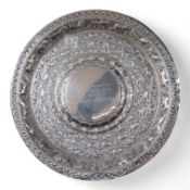 A mid 20th century Ceylonese white metal (tests as silver) presentation charger, embossed with