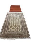 A North West Persian fawn ground rug, 196 x 126cm together with a flatweave rug