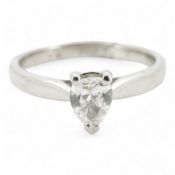 A diamond ring, claw-set with a pear-shaped diamond weighing approximately 0.45 carats, mounted in