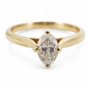 A diamond ring, claw-set with a marquise-shaped diamond weighing approximately 0.70 carats,