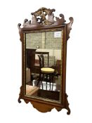 A George III style mahogany fret cut wall mirror, width 38cm, height 68cm