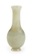 A Chinese celadon jade vase, 18th century, of flattened bottle form, incised with a prunus tree amid