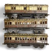 Three Carette for Bassett-Lowke 0 gauge tinplate GWR clerestory bogie coaches; two First Third