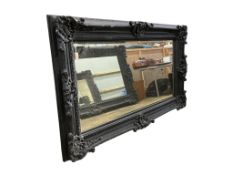 A large Victorian style 'Heritage' rectangular black painted wall mirror, width 226cm, height 136cm