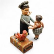 A Gescha, DRGM (Germany), clockwork tinplate acrobatic bellboy on ‘Express’ trunk, together with a