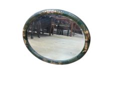 An early 20th century oval chinoiserie lacquer wall mirror, width 68cm, height 53cm