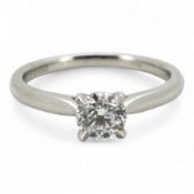 A diamond ring, claw-set with a brilliant-cut diamond weighing approximately 0.55 carats, mounted in