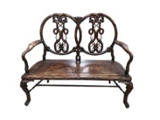 A 19th century Chinese carved hardwood chair back settee, width 116cm, depth 46cm, height 102cm