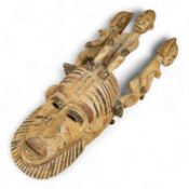 African tribal art interest; a Nigerian carved and painted mask, 54cm
