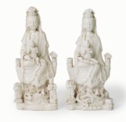 A pair of Chinese blanc de chine groups of Guanyin and children, 18th century, each deity seated
