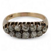 A diamond ring, early 20th century, pavé-set to the front with two rows of cushion-shaped diamonds