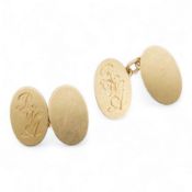 A pair of 18ct gold cufflinks, each end of oval outline, connected by chain linking, engraved with