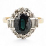 A sapphire and diamond cluster ring, claw-set with an oval sapphire measuring approximately 8.2 x