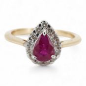 A ruby and diamond cluster ring, claw-set with a pear-shaped ruby weighing approximately 0.60