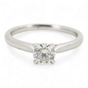 A diamond ring, claw-set with a brilliant-cut diamond weighing approximately 0.57 carats, mounted in