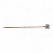 A diamond stick pin, early 20th century, claw-set with a circular-cut diamond weighing approximately