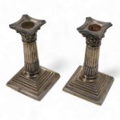 A pair of late Victorian silver Corinthian column dwarf candlesticks, by Charles Boyton II,