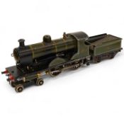 An 0 gauge live steam spirit fired tinplate GWR 4-4-0 tender locomotive, possibly Bing for Bassett-