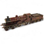 An 0 gauge Bing clockwork tinplate Midland Railway 4-4-0 tender locomotive, 999, in maroon livery