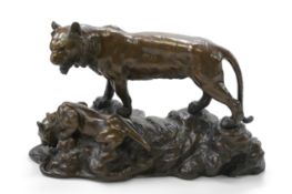 After Genryusai Seiya, a large patinated bronze group of two tigers on a riverbank,