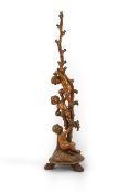 A late 19th / early 20th century Italian carved walnut torchere now as a standard lamp, modelled