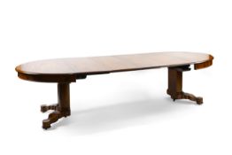 A mid 19th century Continental mahogany extending dining table of rectangular oval form on cluster
