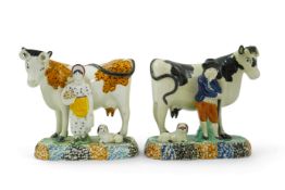 Two Yorkshire Prattware cows, with farmer or milkmaid and dog groups, c.1810, each on a shaped