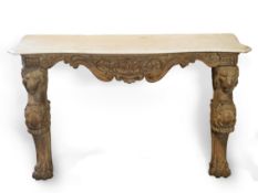 A 19th century Baroque style marble topped limed oak serpentine console table with carved fruiting