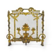 A Louis XVI style gilt bronze and iron mesh fireguard, late 19th century, decorated with a central