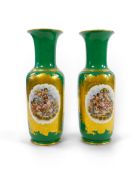 A pair of large Paris porcelain vases, late 19th century, each painted with cherubs floating on a