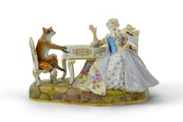 A Meissen group of a fox at the piano and a lady listening, after J. J. Kandler, late 19th