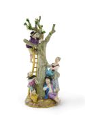 A Meissen group of apple pickers, 19th century, underglaze blue crossed swords mark and incised