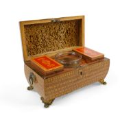A Regency red lacquer penwork tea caddy, of domed rectangular form, with fitted interior and vineous
