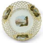 A Meissen topographical reticulated dresser plate, 19th century, painted to centre with a view of