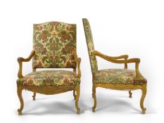 A pair of 19th century Louis XV style carved walnut grand fauteuil with machined polychrome floral