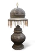 A large Moroccan pierced brass lamp and shade, 20th century, the shade with glass beaded fringe