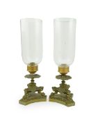 A pair of Empire style ormolu storm lanterns, 19th century, each cast three lion monopodia, on a