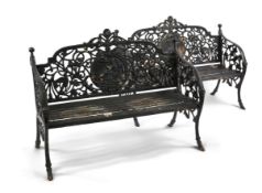 A pair of Victorian Coalbrookdale style painted cast iron medallion garden benches, the pierced