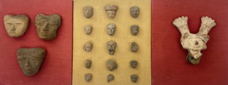 A group of pre-Colombian pottery heads from various cultures, Mexico, mounted on three boards to