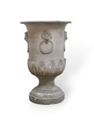 A 19th century circular earthenware urn with lion mask and ring moulded body on stepped foot,