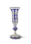 A tall 19th century Bohemian blue and white overlaid gilt and enamel decorated vase in the manner of