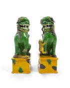 A pair of large Chinese sancai-glazed biscuit figures of Buddhist temple lions, 19th century, one