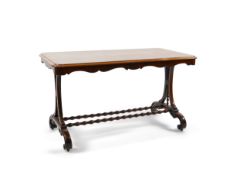 A Victorian rectangular rosewood library table on shaped end standards with twin bobbin stretcher on