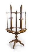 A 19th century French salon beech four way revolving easel, 86cm wide, 200cm high