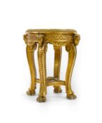 A late 19th century French circular carved giltwood and composition vase stand, the variegated