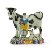 A James Emery, Mexborough pearlware cow, calf and milkmaid group, c.1820, decorated in typical Pratt