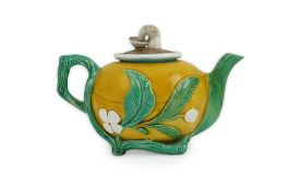 A rare Minton majolica teapot, c.1867, modelled in relief as a gourd with leafy branch handle and