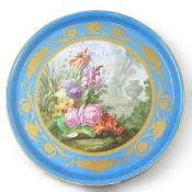 A large Sevres style porcelain charger, late 19th century, the centre painted with flowers in a